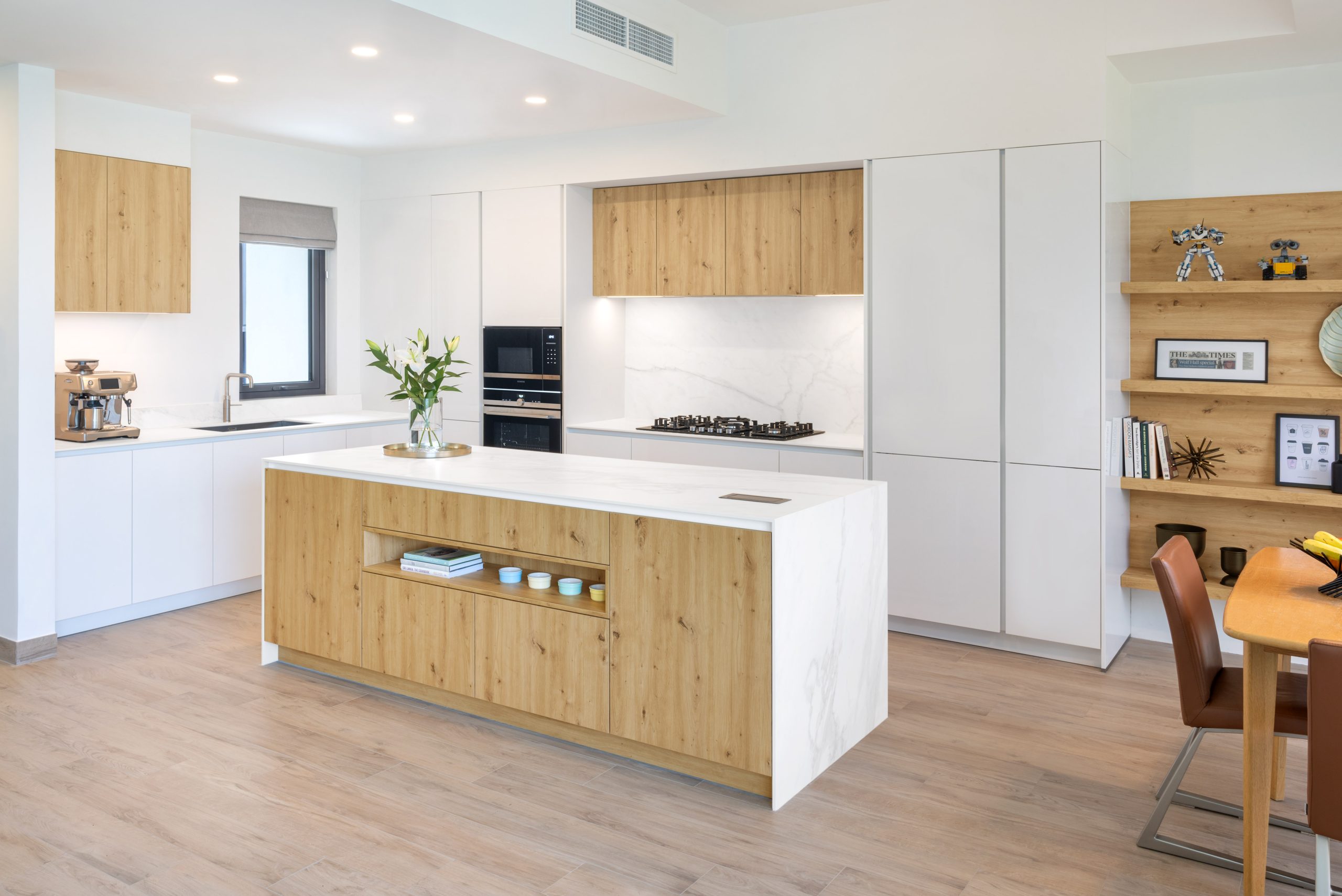 Modern white and wood kitchen in Dubai Hills.